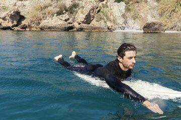 Surfeur sur sa planche