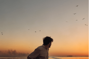 Homme sur une barque dans les marais d’Hawizeh